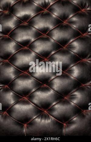 Luxurious dark brown leather texture, vintage brown leather background stitched together in a diamond shape. Stock Photo
