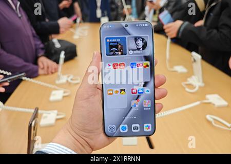 SHANGHAI, CHIAN - APRIL 18, 2024 - Customers experience various functions and features of Huawei's newly released Pura70 mobile phone at the Huawei fl Stock Photo