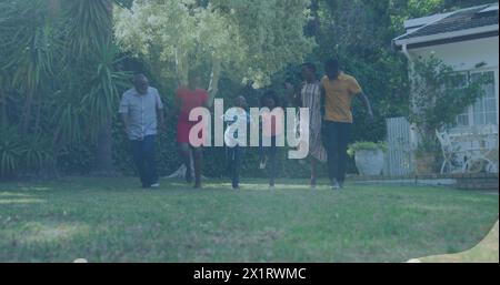 African American family enjoying time in garden, senior man leading Stock Photo