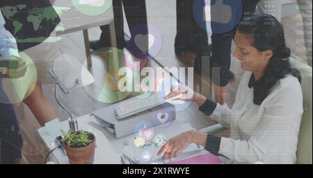 Biracial colleague wearing glasses, analyzing data on tablet Stock Photo