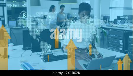 Diverse group of colleagues working in office, discussing cryptocurrency Stock Photo