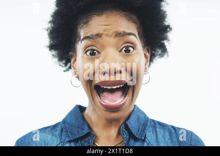 Black woman, portrait and shock with scare, fright or wow for anxiety, fear or stress on a white studio background. Face of African or young female Stock Photo