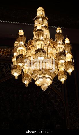 Sultan Qaboos Grand Mosque Interior showing One of the Smaller Chandeliers  with Swarovski Crystals hanging above the Main Prayer hall (Musalla) Musca Stock Photo