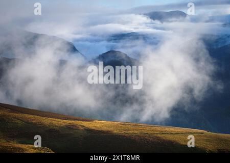Low clouds rolling in over the lakeland fells. Stock Photo