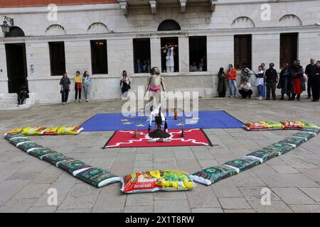 Italy, Venice, April 17, 2024 : An artist performs out of Arsenale during the 60th Venice Art Biennale in Venice on April 17, 2024.  The 60th International Art Exhibition will be open to the public from April 20 to November 24 and will be titled 'Strangers Everywhere'. Venice, Italy    Photo © Ottavia Da Re/Sintesi/Alamy Live News Stock Photo