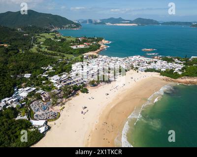 Shek O, Hong Kong: Aerial drone footage of the Shek O beach and town in Hong Kong island on a sunny summer day. Stock Photo