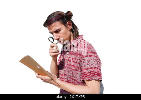 A blind man reading with a magnifying glass a book. concept of blindness problems Stock Photo
