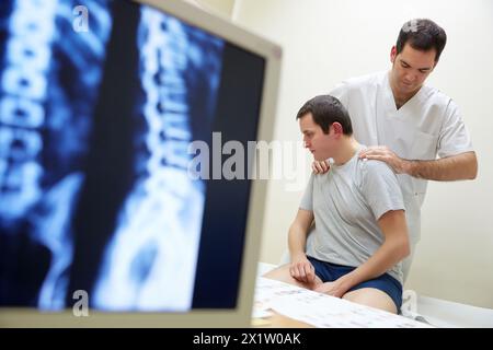 Rotation and passive flexion back X-ray image of the spinal column Physiotherapy medical center, Donostia, San Sebastian, Gipuzkoa, Basque Country, Spain. Stock Photo