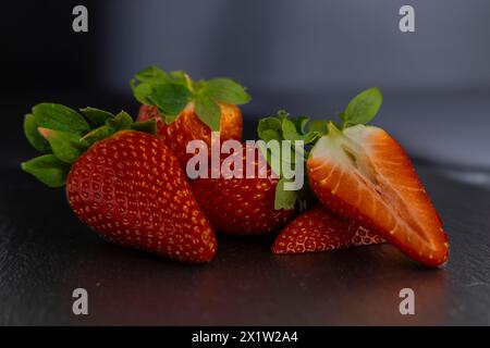 Strawberries (Fragaria) on a slate plate Stock Photo