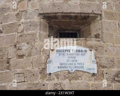 Plaque dedicated to Guiseppe Garibaldi at the Torre di Garibaldi, tower of the fortress, Alghero, Sardinia, Italy Stock Photo