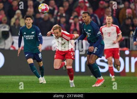 Harry Kane, FCB 9  compete for the ball, tackling, duel, header, zweikampf, action, fight against Gabriel, Arsenal 6  in the quarter final match   FC BAYERN MUENCHEN - FC ARSENAL LONDON 1-0 of football UEFA Champions League in season 2023/2024 in Munich, Apr 17, 2024.  Viertelfinale,, FCB, Muenchen Photographer: ddp images / star-images Stock Photo