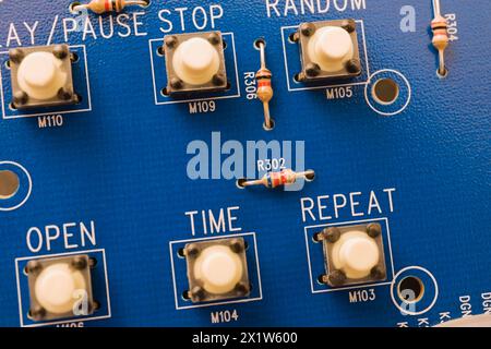 Close-up of blue electronic DVD player circuit board with function push button controls, Studio Composition, Quebec, Canada Stock Photo