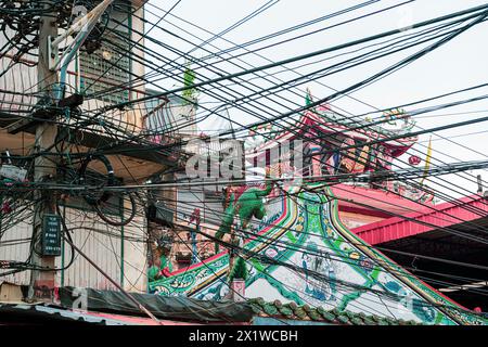 Chaotic wiring, power, chaos, power cable, safety, danger, power grid, energy, confusion, safety concerns, Bangkok, Thailand Stock Photo