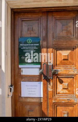 Notice on the door of Lloyds bank, explaining the closure of it's Sidmouth branch, the last bank in the small Devon town. Stock Photo