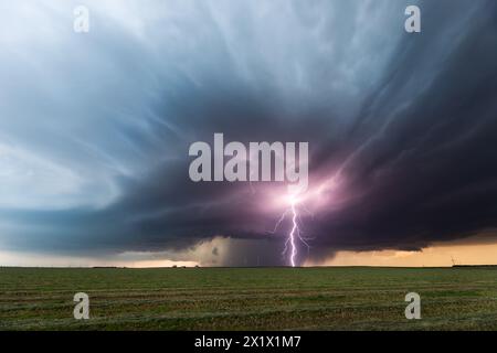 Severe weather. Thunderstorm lightning strike over a field in Colorado Stock Photo