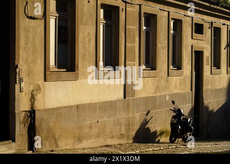 Afternoon Sunshine Casting Shadows on an Old Street in Lisbon, Portugal Stock Photo