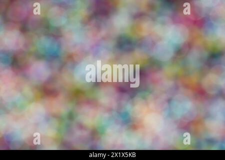 Abstract bokeh background of colorful glowing lights in soft focus, in bright sunlight Stock Photo