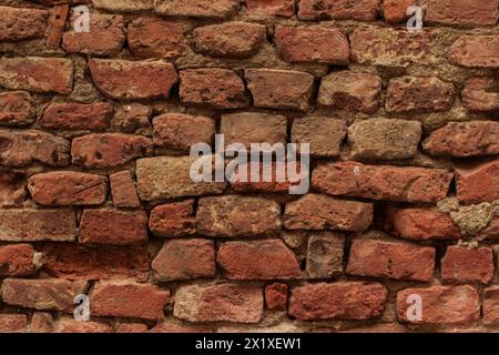 Old worn brick wall in Siena, Italy Stock Photo