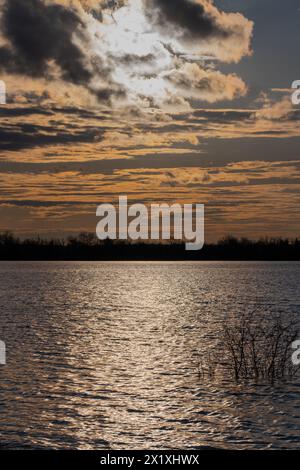Beautiful sunset over lake. Beautiful sky with clouds Stock Photo