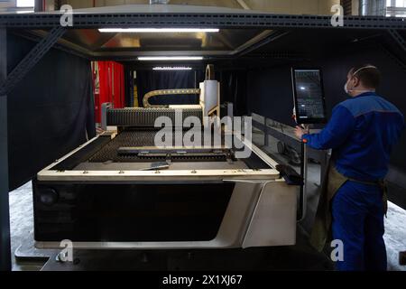Laser cutting machine with CNC is cutting the steel sheet. Stock Photo