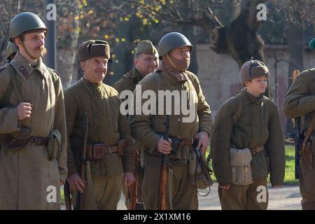 Vorzel, Ukraine - November 03, 2019: People in the form of Red Army soldiers stand in formation with weapons on the historical reconstruction of the a Stock Photo