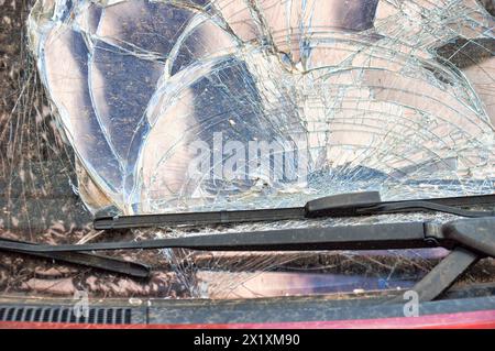 Detail of damage to windscreen of car shattered by vandalism Stock Photo