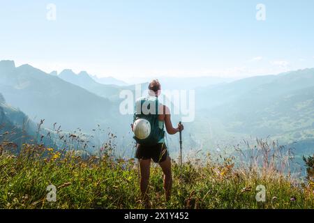 Description: Close up of atlhetic woman enjoing the view from a vantage point on the Walensee in the morning. Schnürliweg, Walensee, St. Gallen, Switz Stock Photo