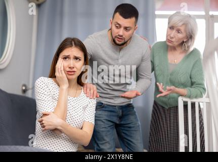 Family quarrel - wife cries after husband and elderly mother screams