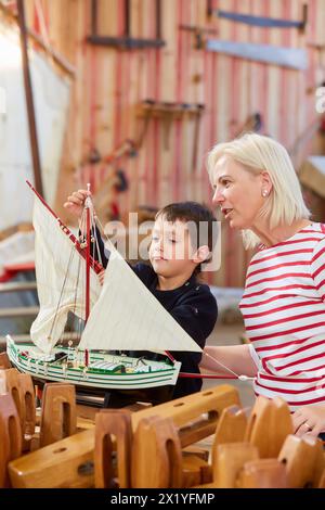 Grandmother and grandson, Building model sailboat, Whaleship, Pasaia, Gipuzkoa, Basque Country, Spain, Europe. Stock Photo