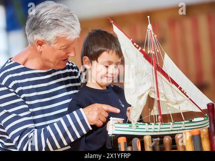 Grandfather and grandson, Building model sailboat, Whaleship, Pasaia, Gipuzkoa, Basque Country, Spain, Europe. Stock Photo
