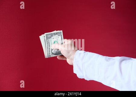 female hands hold paper dollars banknotes, counting a bundle of money, concept of cash, payments, savings Stock Photo