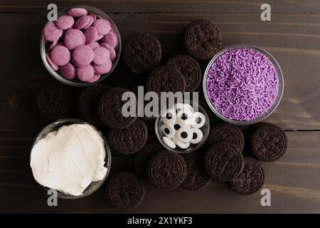 Ingredients for Purple Halloween-Themed Monster Truffles: Sandwich cookies, cream cheese, and other ingredients for cookies and cream truffles Stock Photo