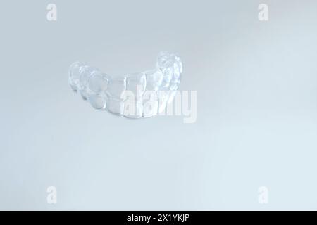 close-up of transparent Silicone Night Mouth Guard for Teeth Clenching Grinding Dental Bite Sleep Aid, concept dental services, remedy for grinding te Stock Photo