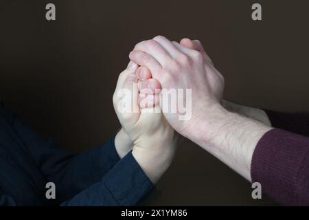 close-up of female and male hands, concept of love, relationship, trust, friendly support Stock Photo