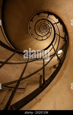 Spiral staircase in the Arc de Triomphe de l'Étoile to the modern high-rise district of La Défense, Paris, Île-de-France, France, Europe Stock Photo