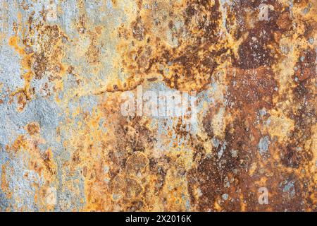 Rusty rustic  dirty stone textured cracked cement grungy weathered wall organic stained Stock Photo