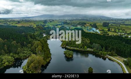 Drone perspective  of Lake Mangamahoe Taranaki  surrounded by forest Stock Photo
