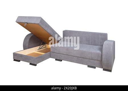 Gray unfolded sofa with velor fabric pillows isolated on a white background. Cushioned furniture. Stock Photo