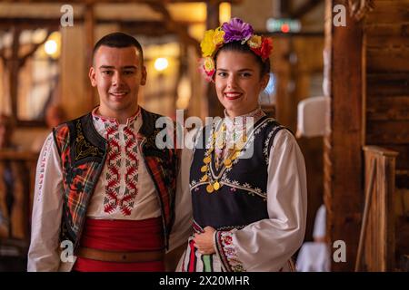 Traditional Bulgarian folklore is performed at Mehana Chiflika restaurant for guests of river cruise ship Bolero (Nicko Cruises) on the Danube, Ruse, Stock Photo