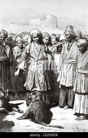 Monkey trainers at Veys, Khuzestan Province, Iran. Middle East. Drawing by Edouard Zier (1856 - 1924) Persia, Chaldea and Susiana 1881-1882 by Jane Dieulafoy (1851 - 1916) Le Tour du Monde 1886 Stock Photo