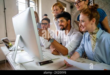 Programmers cooperating at IT company developing apps. Business people technology concept Stock Photo