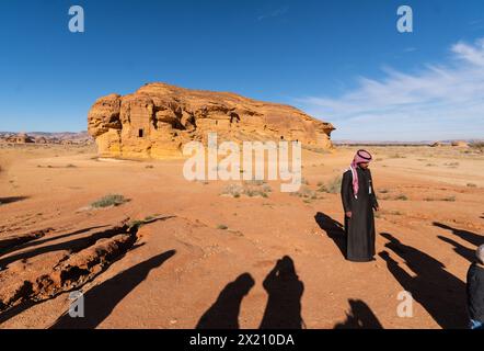 Al Ula, Saudi Arabia - February 05 2023: A Saudi tour guide explain the visit of the tombs of the Nabatean civilization in Al-Ula at the Madain Saleh Stock Photo