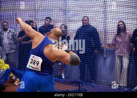 Athlete throws an iron shot at Indoor Championship of Ukraine in track and field athletics. Shot Put 7,260 kg Men Final competition. Kyiv - 2 February, 2024 Stock Photo