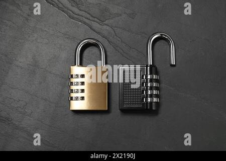 Steel combination padlocks on black table, top view Stock Photo