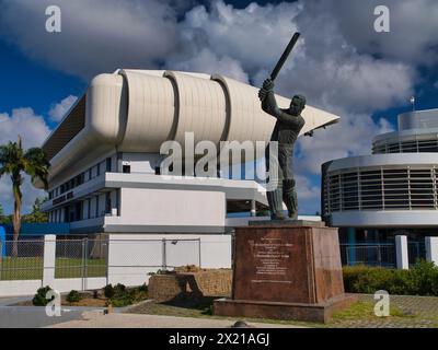 Bridgetown, Barbados - Jan 28 2024: The statue of Sir Garfield Sobers, also known as Gary Sobers, in front of the Worrell, Weekes and Walcott (3Ws) St Stock Photo