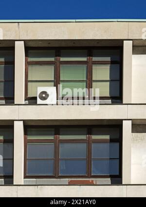 air conditioner outside an office building window, Italy Stock Photo