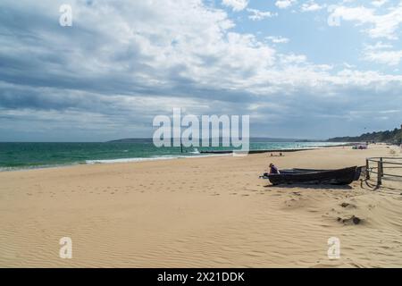 Middle Chine, Bournemouth, UK - July 12th 2023: Almost empty beach with rowboats on the sand. Stock Photo