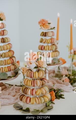 Closeup of Macaroon Tower with Candles in Background Stock Photo