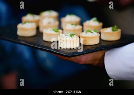 Hors d'oeuvres presented by server Stock Photo