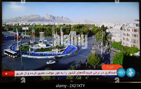 Tehran. 19th Apr, 2024. This photo taken on April 19, 2024 shows a screen displaying live footage aired by the Iranian state television from the urban area of Isfahan, Iran. 'There was no damage to Iran's nuclear sites' in an attack in northeast of Iran's central Isfahan province, the International Atomic Energy Agency (IAEA) confirmed Friday. Credit: Shadati/Xinhua/Alamy Live News Stock Photo